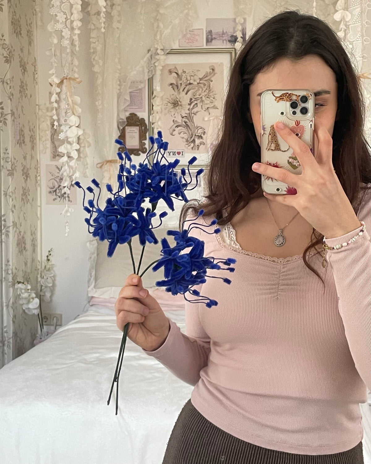 Close-up of handmade blue pipe cleaner flowers