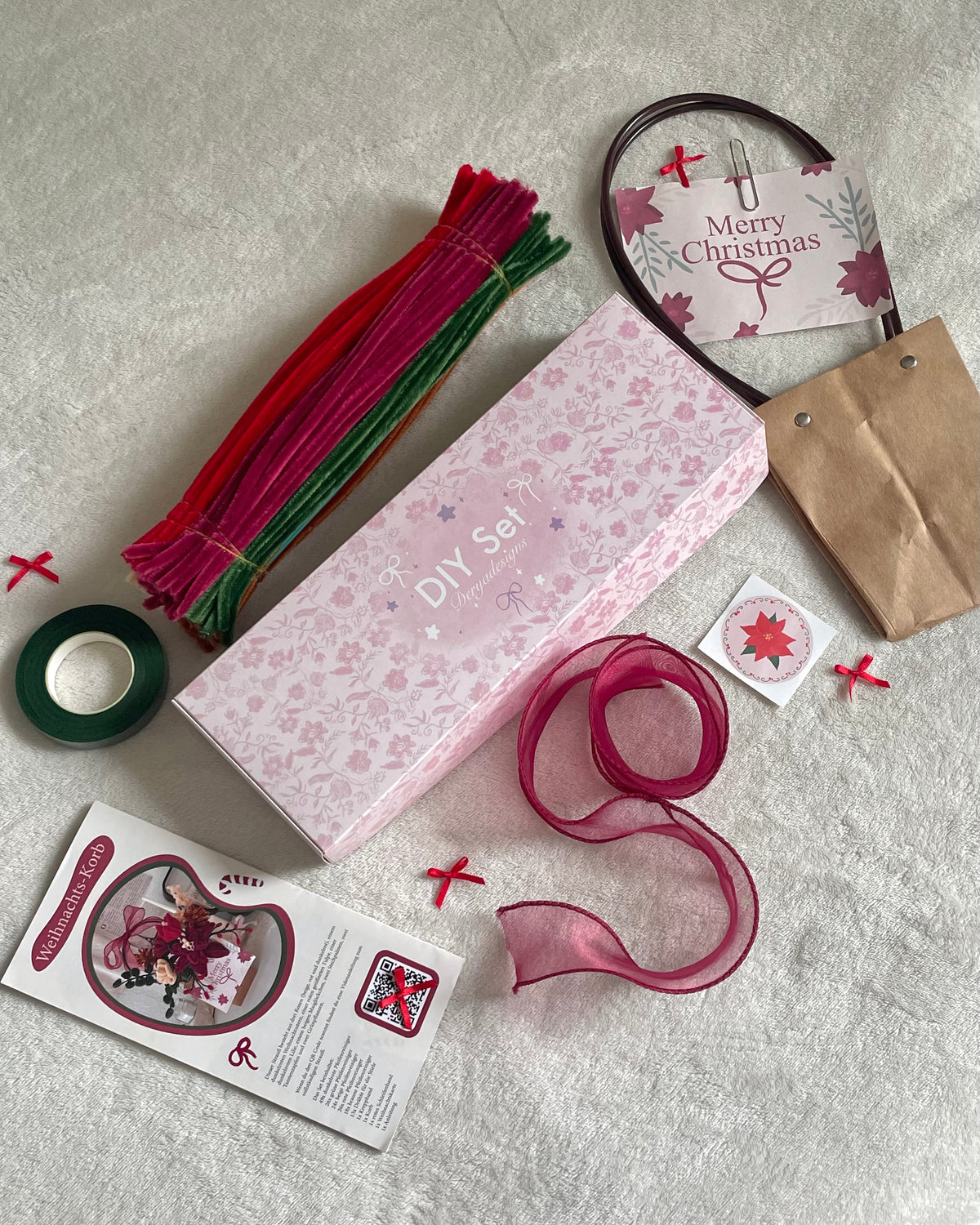 Christmas Basket DIY kit materials including pipe cleaners, ribbon and floral tape