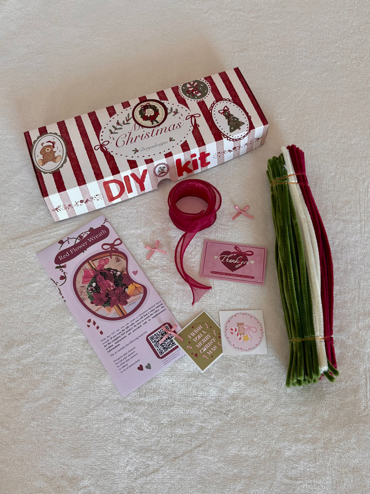 Red Flower Wreath DIY kit materials with colored pipe cleaners and ribbon