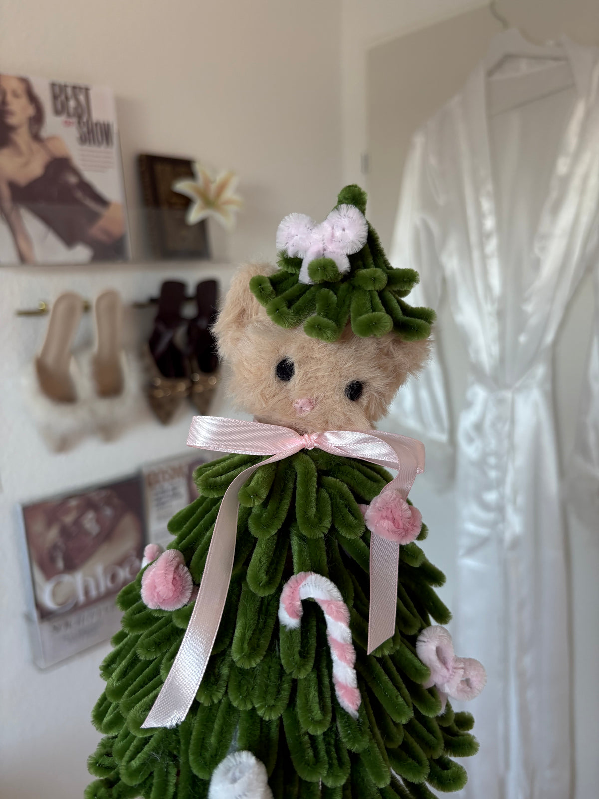 Close-up of the teddy bear details on a handmade pipe cleaner Christmas tree