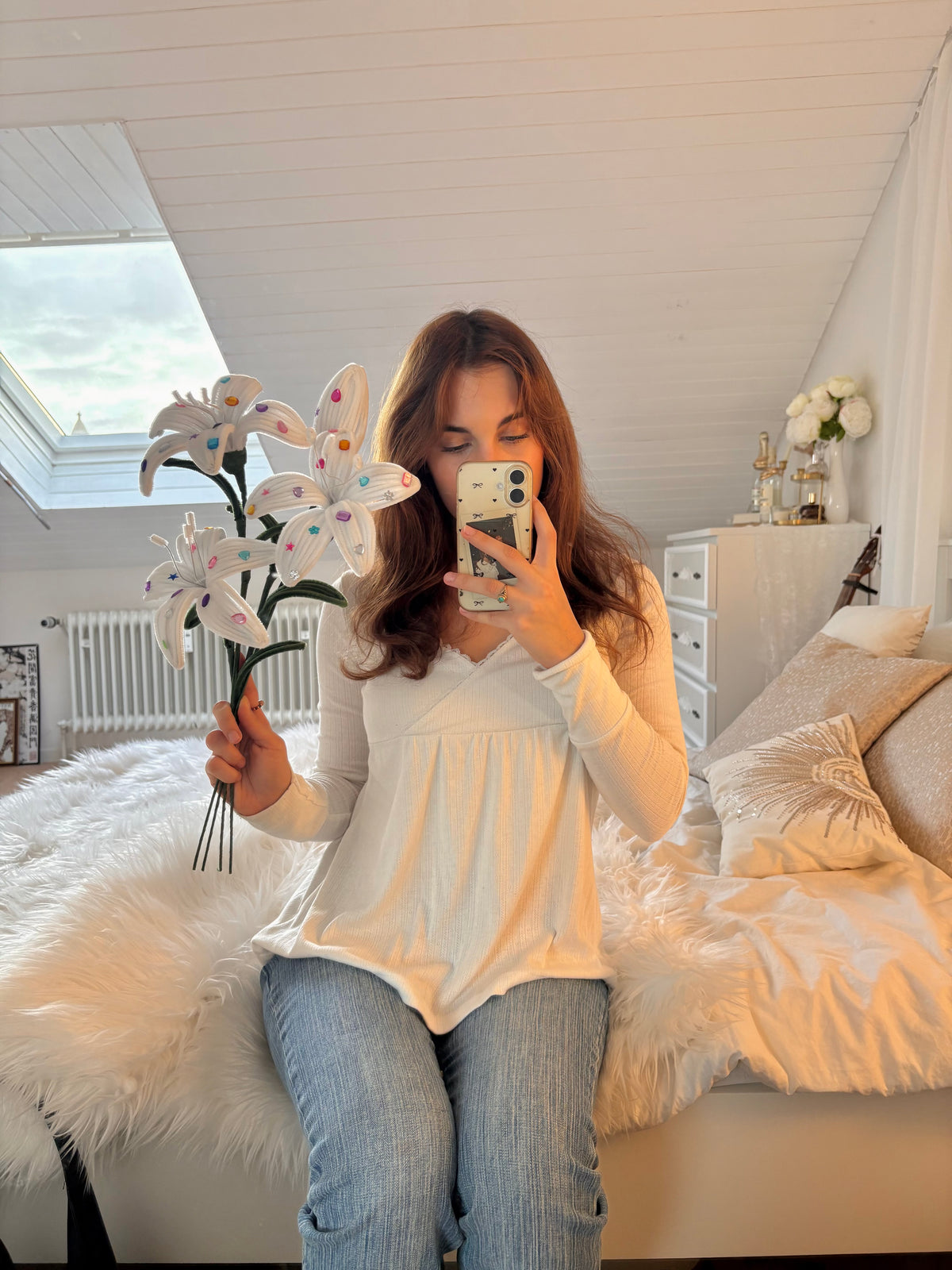White DIY lily bouquet with green stems and leaves