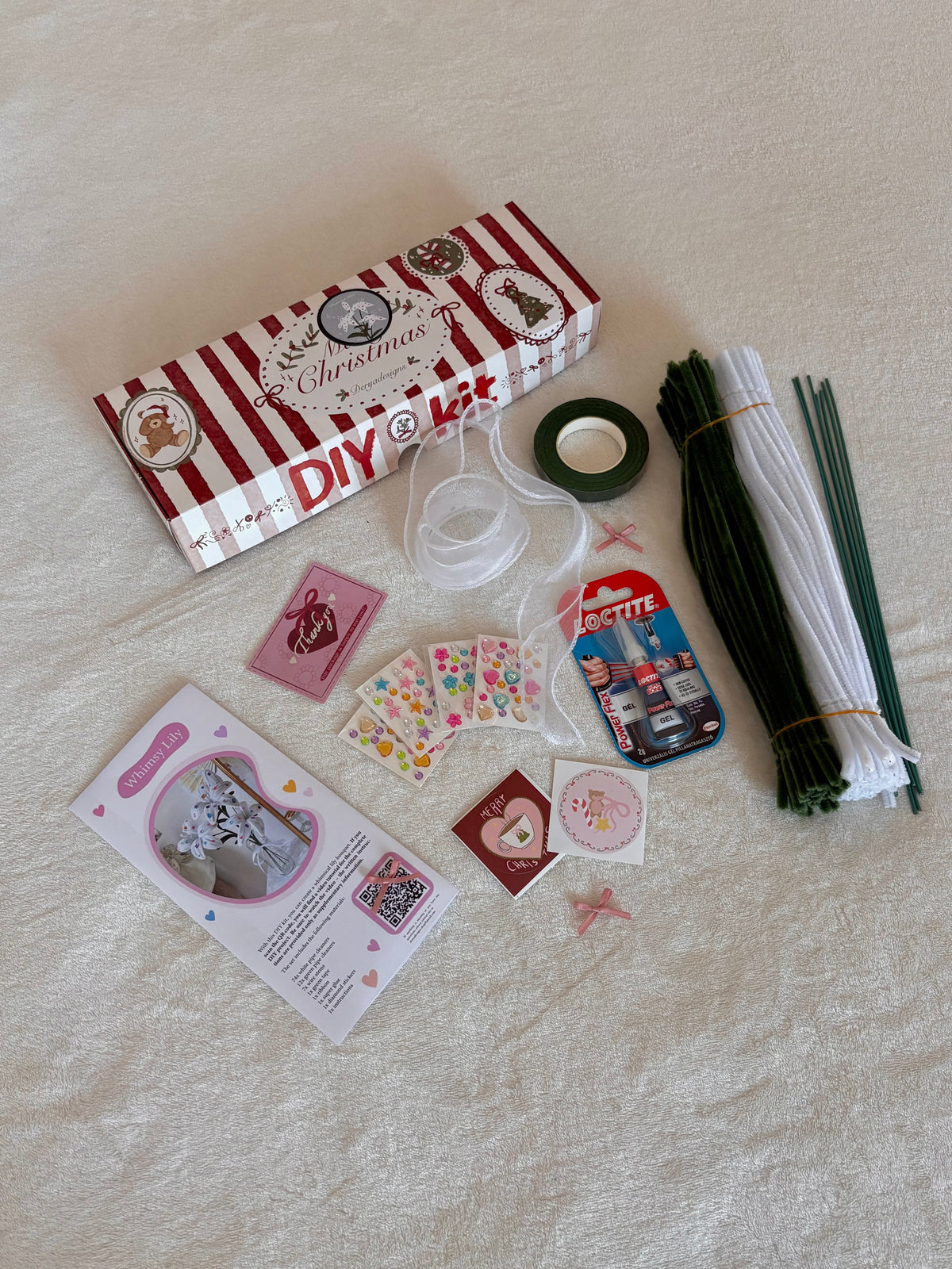DIY lily bouquet kit with white and green pipe cleaners and craft supplies