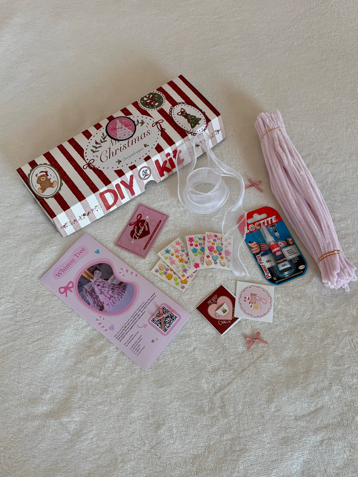 Pink Christmas tree DIY kit with pipe cleaners, stickers, glue and ribbon