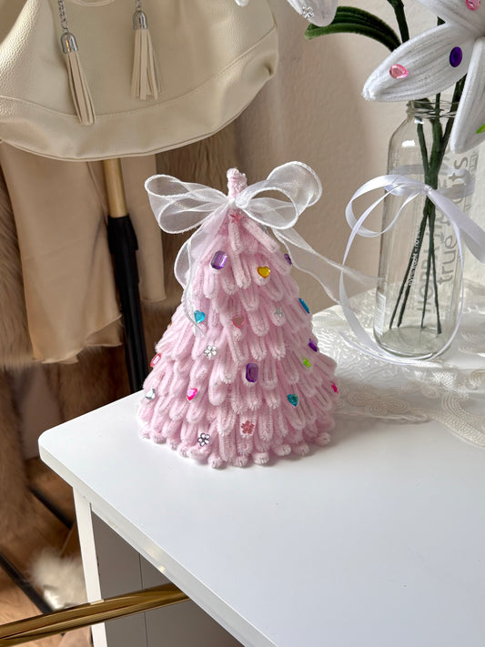 Pink Christmas tree handmade from pipe cleaners with a white ribbon